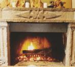 Stone fireplace with prehistoric symbols