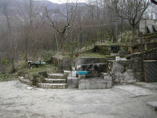 Fountain in draft of travertine